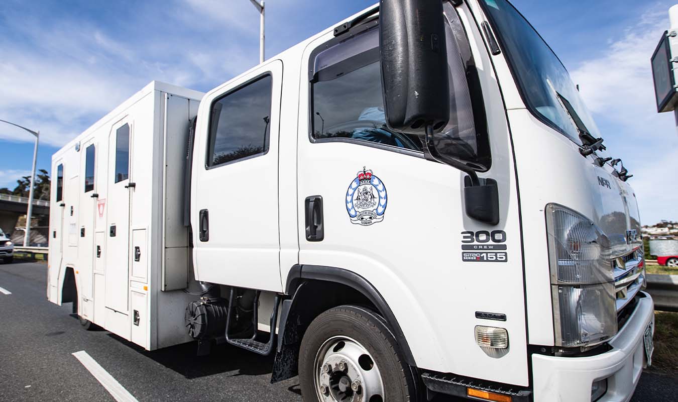 Fire breaks out in prison transport van on Hobart highway with ‘a